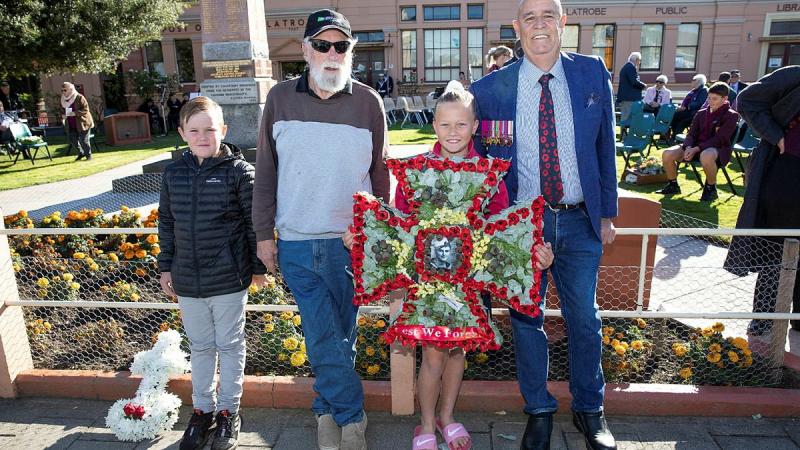 Relatives of Ordinary Seaman Edward “Teddy” Sheean, VC prepare to lay a wreath at an Anzac Day Service in Latrobe, Tasmania. From left, Mr Andrew Jarvie, Mr Ted Sheean, Miss Bella Sheean and Mr Garry Ivory. Photo: Petty Officer Tom Gibson