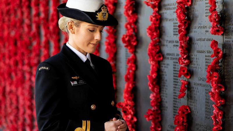 Lieutenant Sarah Rohweder reflects in front of the Roll of Honour at the Australian War Memorial in Canberra. Photo: Leading Seaman Kayla Jackson 