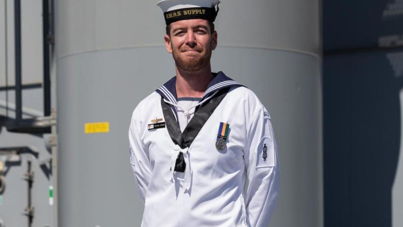 Able Seaman Communication and Information Systems Tristan Strong onboard HMAS Supply. Photo: Leading Seaman David Cox