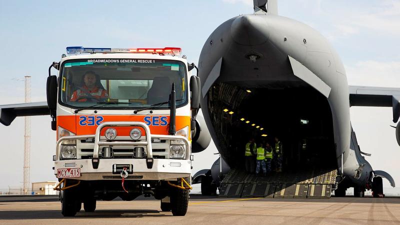 A Victorian State Emergency Service is driven off an Air Force C-17A Globemaster III aircraft, after being delivered from to Geraldton in Western Australia from Melbourne. Photo: Leading Seaman Kieren Whiteley