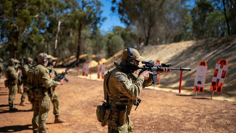 Officers and soldiers from 11/28th Battalion, Royal Western Australia Regiment and Clearance Divers from Australian Clearance Diving Team - Four fire at targets as part of an enhanced combat shooting exercise. Photo: Leading Seaman Ronnie Baltoft