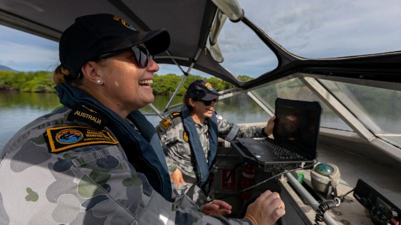 Able Seaman Deneki Stewart, right, and Leading Seaman Tanya Maksimovic conduct surveying operations in Chinaman Creek in Cairns. Photo: Leading Seaman Shane Cameron