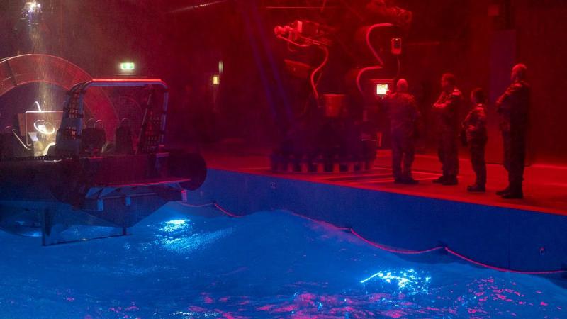 Deputy Fleet Commander Commodore Jonathon Earley tours the facility that houses the rigid-hull inflatable boat training simulator at HMAS Cerberus, Victoria. Photo: Leading Seaman James McDougall