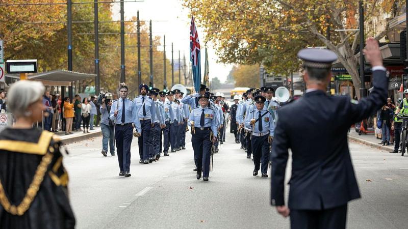 South Australian Police Chief Superintendant Stuart McLean challenges No. 24 (City of Adelaide) Squadron during a march along King William Street to Adelaide Town Hall. Photo: Leading Aircraftman Sam Price