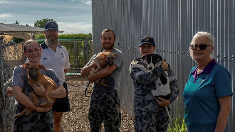 Seaman Brianna Clarkes, left, Chief Petty Officer Stuart Rowe, Seaman Kurt Barnett and Seaman Riley Fletcher with Senior Trainer Lisa Hansen at the PAWS Animal Shelter in Darwin. Photo: Lieutenant Gordon Carr-Gregg  