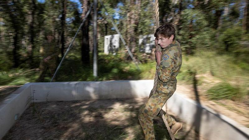 Cadet Warrant Officer Class 2 Hunter Folkes, of Sydney Grammar Army Cadet Unit, swings over the rope pit during the Adventure Training Award at Holsworthy Barracks. Photo: Trooper Jarrod McAneney 