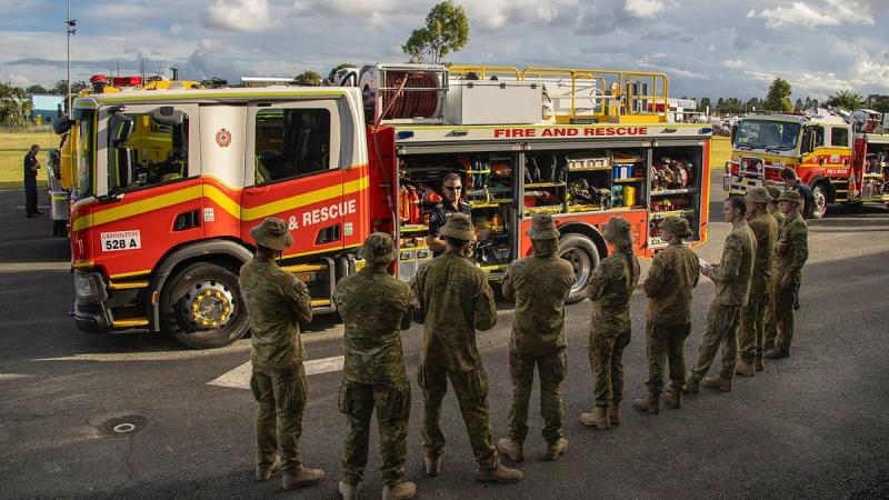 Members of 2/14 Light Horse Regiment (Queensland Mounted Infantry) receive a briefing from the Queensland Fire and Emergency Services during Exercise Incendium on the Sunshine Coast. Photo: Sergeant Brendan Davis