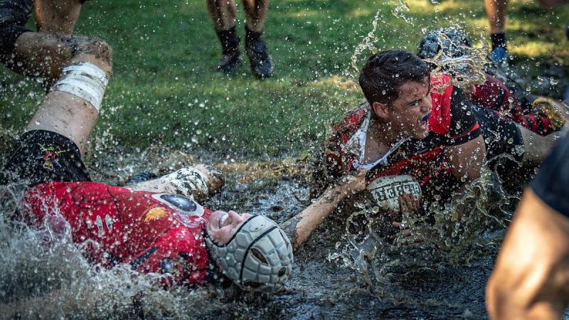 Players from 17 Sustainment Brigade and Combined Arms Training Centre rush to the try line during the Australian Army Inter-Brigade Rugby Competition in Brisbane. Photo: Private Jacob Hilton 