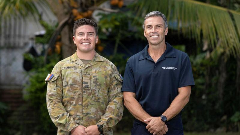 Signaller Jack Connoley with his father, Australian Federal Police Federal Agent John Connoley, at the Vanuatu Police Training College in Port Vila. Photo: Corporal Olivia Cameron 