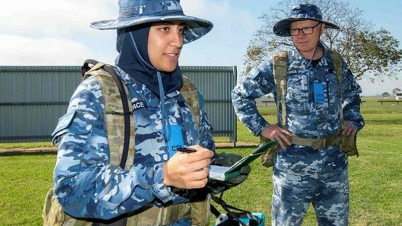 Flying Officer Ayah Khalid, left, with Leadership Reaction Course team member Flying Officer Clayton Wilson during a course at Officer Training School at RAAF Base East Sale. Photo: Flight Sergeant Scott Robbins