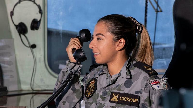  Leading Seaman Lodia Lockhart communicates in Bahasa Indonesia to the Indonesian frigate KRI Diponegoro. Photo: Leading Seaman Thomas Sawtell 
