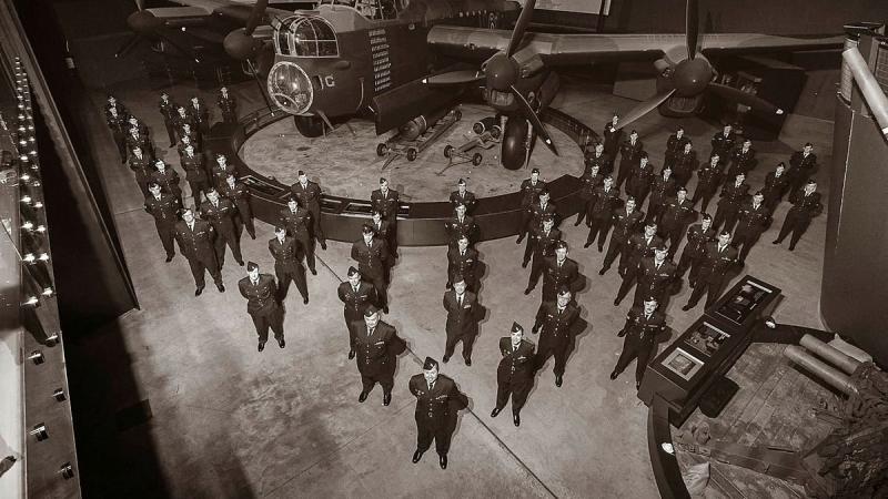 No. 460 Squadron aviators pose in front of the G for George Lancaster bomber at the Australian War Memorial. Photo: Sergeant Oliver Carter