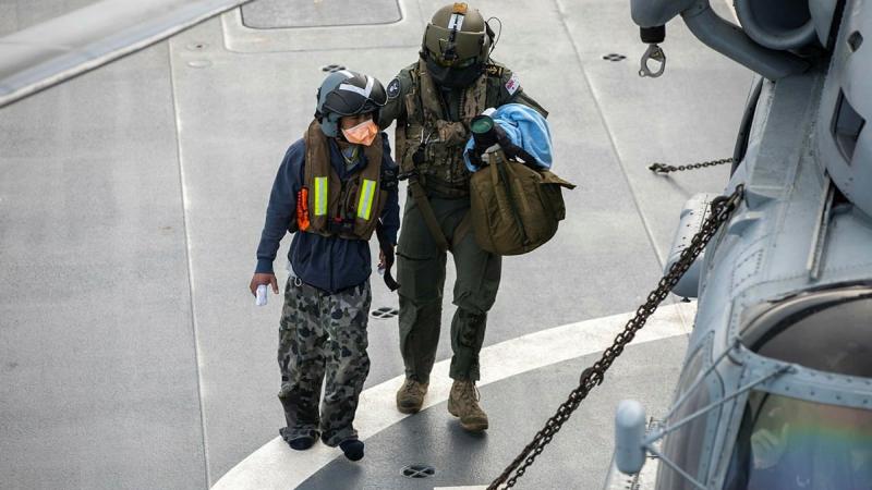 An Indonesian fisherman rescued in the Indian Ocean is airlifted to Perth from HMAS Anzac in the ship's embarked MH-60R helicopter. Photo: Leading Seaman Thomas Sawtell