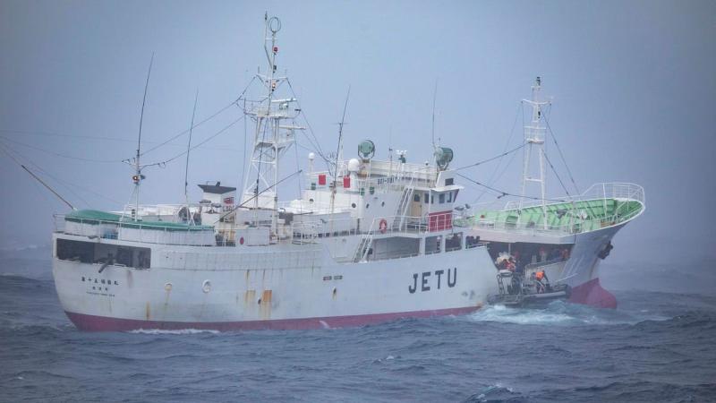 A rigid-hulled inflatable boat from HMAS Anzac takes on rescued Indonesian fishermen from the Japanese vessel Fukuseki Maru No. 15 in the Indian Ocean. Photo: Leading Seaman Thomas Sawtell