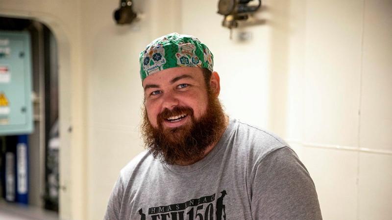 Able Seaman Maritime Logistics Support Operator Rowan Fox helps prepare meals in HMAS Anzac's galley. Photo: Leading Seaman Thomas Sawtell
