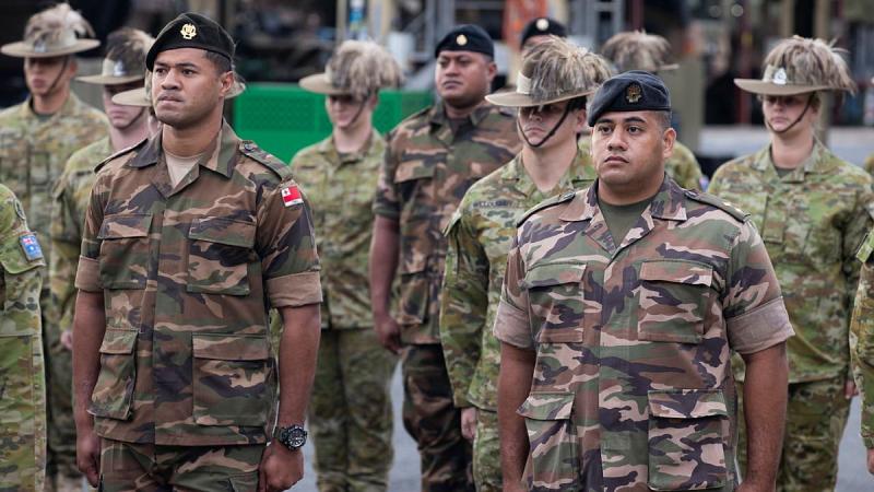 Second Lieutenant Sione Kaufononga, front left, and Lieutenant Esafe Vanipola, front right, from His Majesty’s Armed Forces Tonga during the official welcome ceremony at Brisbane. Photo: Corporal Nicole Dorrett