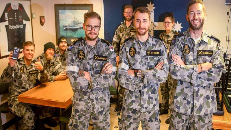 HMAS Ballarat's Quality of Life administration team Able Seaman Adam Ballintijn, front left, Leading Seaman Reece Sturges and Leading Seaman Liam Anderson in the ship's junior sailors’ cafe. Photo: Leading Seaman Ernesto Sanchez