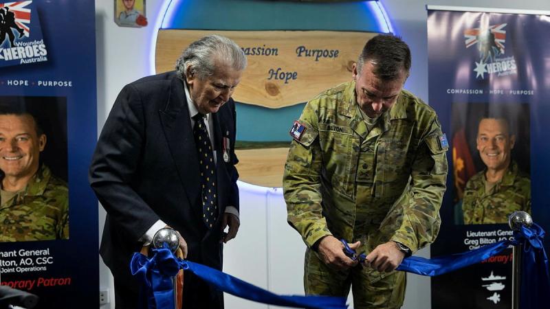 Founder of Wounded Heroes Australia Jim Shapcott, left, with Chief of Joint Operations Lieutenant General Greg Bilton cutting the ribbon to open Wounded Heroes Australia Veterans Lounge at Alderley, Brisbane. Photo: Corporal Nicole Dorrett