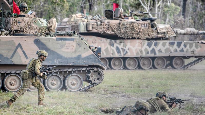 Soldiers from 6th Battalion, Royal Australian Regiment, conduct a live-fire offensive operation serial with support from 2nd/14th Light Horse Regiment (Queensland Mounted Infantry) and 2nd Combat Engineer Regiment. Photo: Private Jacob Hilton