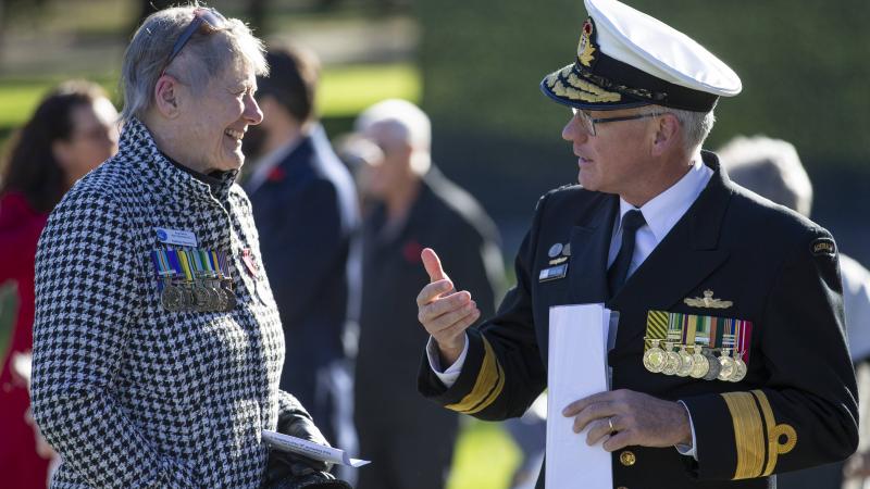 Deputy Chief of Navy Rear Admiral Chris Smith speaks with Secretary of the Australian War Widows ACT Dr Kathryn Spurling at the Sandakan memorial service.  Photo: Petty Officer Bradley Darvill