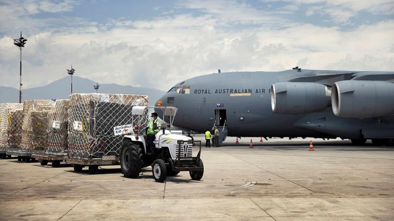 A delivery of humanitarian aid supplies from Western Australia, transported by a RAAF Force C-17A Globemaster III is received at Tribhuvan International Airport in Nepal. Photo: Corporal Robert Whitmore