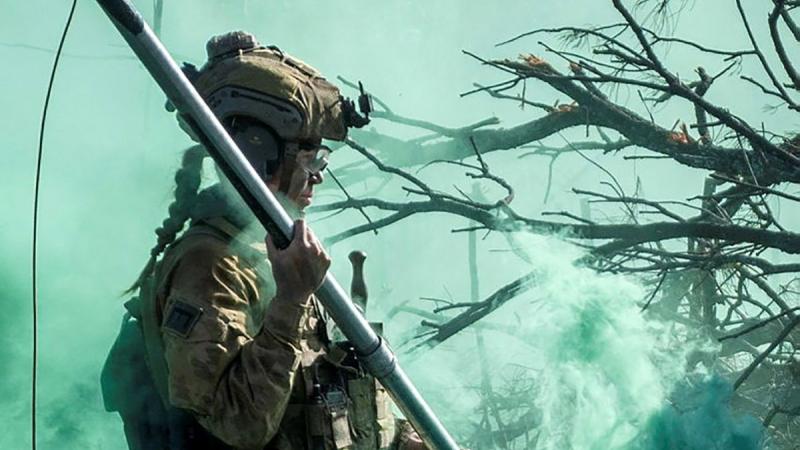 Sapper Chloe Leifels, of the 2nd Combat Engineer Regiment, moves to place a Bangalore torpedo explosive charge onto an obstacle during Exercise Diamond Walk. Photo: Sergeant Karl Booth