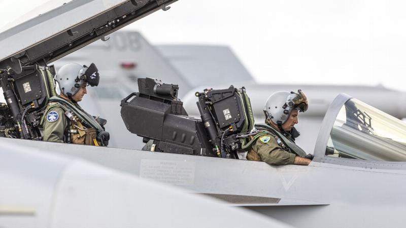 Aircrew from No. 6 Squadron run system checks as part of the pre-flight routine on an EA-18G Growler at RAAF Base Darwin during Exercise Arnhem Thunder 21. Photo: Leading Aircraftman Stewart Gould