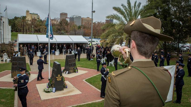 Musician Will Madden plays the Last post at the 79th Anniversary Commemoration Ceremony of Bomber Command held at the Air Force Memorial, Torrens Parade Ground in Adelaide. Photo: Sergeant Murray Staff