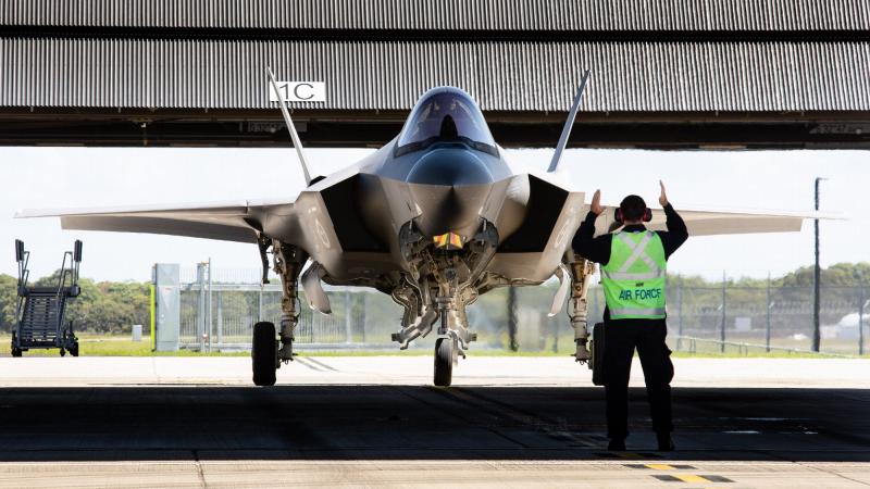 A pilot is marshalled in after completing his first flight in an F-35A Lightning II during the Operational Conversion course at RAAF Base Williamtown. Photo: Sergeant Guy Young 
