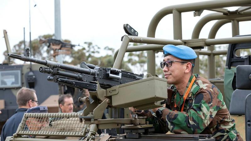Defense Attaché to the Royal Embassy of Cambodia, Colonel Khanrithy Morn from the Royal Cambodian Army, inspects the weapon system mounted to a No. 3 Security Forces Squadron vehicle at RAAF Base Edinburgh. Photo: Leading Aircraftman Sam Price