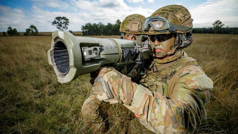 Airfield defence guards Leading Aircraftman Jarryd May, right, and Leading Aircraftwoman Tekaisha Davies from No. 1 Security Forces Squadron prepare to fire the 84mm Carl Gustav at the Singleton Military Training Area. Photo: Corporal Craig Barrett