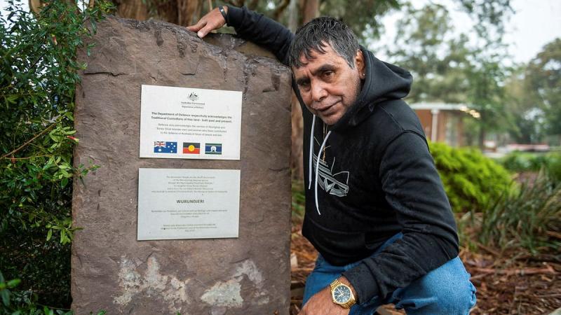 Elder Uncle Ringo Terrick, of the Wurundjeri people, next to the Acknowledgement of Country plaque at Simpson Barracks, Melbourne. Photo: Private Michael Currie