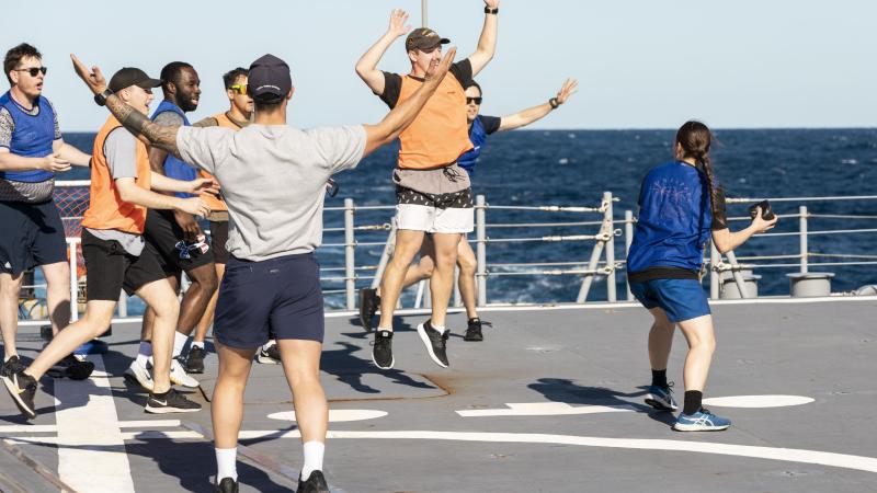 Seaman Boatswain’s Mate Melita Tennant prepares to throw the ball during a Bin Ball competition held on-board HMAS Brisbane, off the coast of Queensland for Exercise Talisman Sabre 2021. Photo: Leading Seaman Daniel Goodman