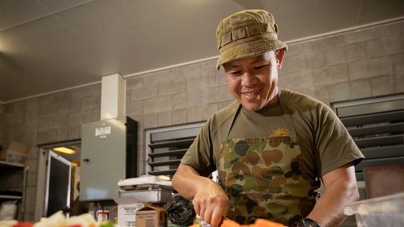 Private Supachai Kladpin, of the 10th Force Support Battalion, cooks meals in the Camp Growl kitchen in the Shoalwater Bay Training Area, Queensland, during Exercise Talisman Sabre. Photo: Corporal Madhur Chitnis