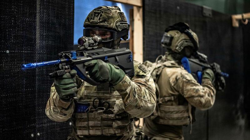 Soldiers from the 8th/9th Battalion, Royal Australian Regiment, conduct unopposed urban warfare training using EF88 Airsoft rifles at Gallipoli Barracks, Brisbane. Photo: Private Jacob Hilton