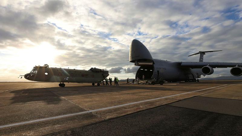 A new CH-47F Chinook heavy-lift helicopter is unloaded from a United Stated C-5 Galaxy at RAAF Base Townsville, Queensland. Photo: Trooper Lisa Sherman