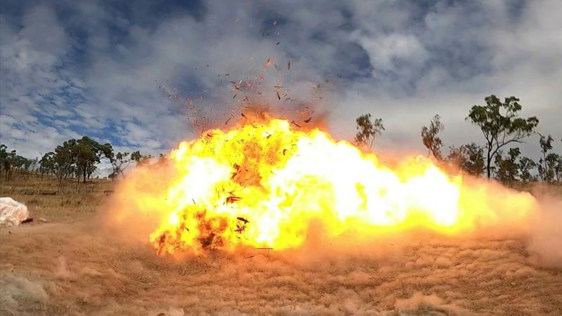 Setting off the charge, a wooden pallet explodes during demolition training on Exercise Phoenix Strike in Townsville, Queensland. Photo: Corporal Brodie Cross