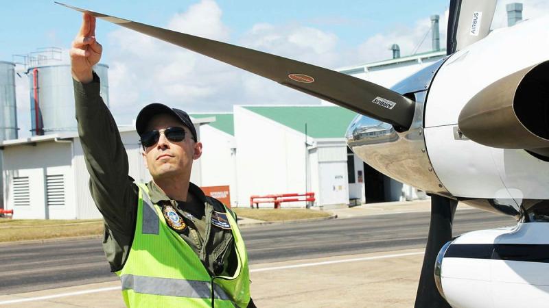 No. 32 Squadron pilot and Detachment Commander Flight Lieutenant Murray Turland performs pre-flight checks on a King Air before a flight in support of Exercise Talisman Sabre. 