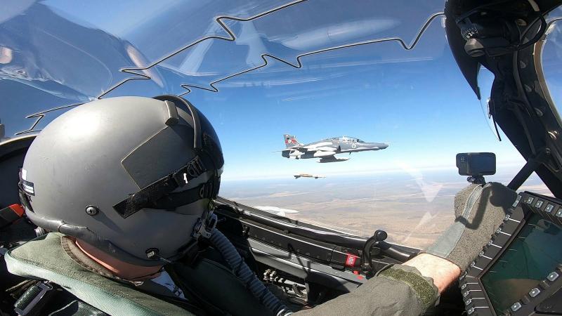A Hawk 127 lead-in fighter pilot from No. 79 Squadron watches as a Hawk 127 from No. 76 Squadron releases a GBU-12 laser-guided Bomb over Delamere Air Weapons Range, Northern Territory.