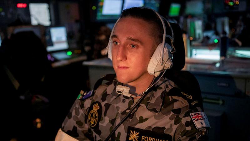 Leading Seaman Joshua Fordham operates an aircraft control console in the operations room of HMAS Ballarat during the ship's Regional Presence Deployment. Photo: Leading Seaman Ernesto Sanchez