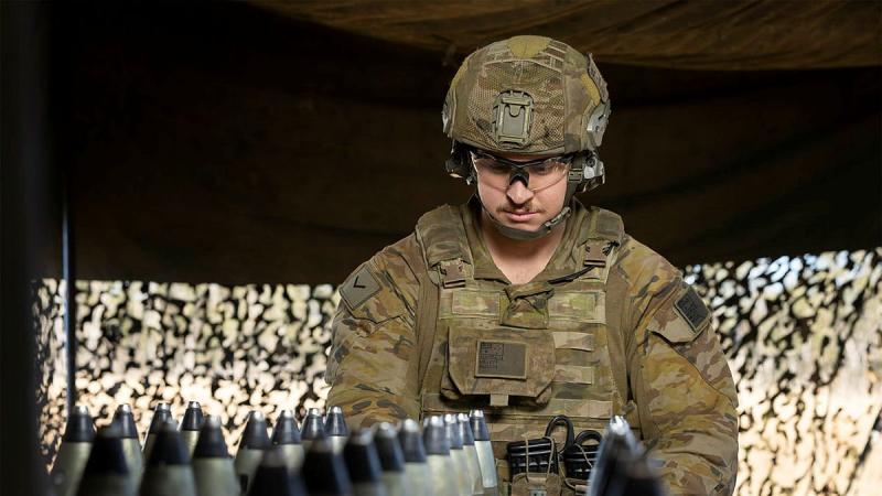 Lance Bombardier Marc Millet, of the 4th Regiment, Royal Australian Artillery, prepares the M777 Howitzer ammunition during Exercise Talisman Sabre. Photo: Corporal Jarrod McAneney