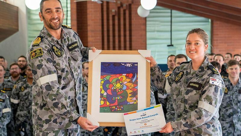 Commanding Officer NUSHIP Stalwart  Commander Steve McCraken presents Leading Seaman Medic Abbey-Rose Yeomans with her award and artwork at HMAS Stirling in Rockingham. Photo: Able Seaman Luke Miller