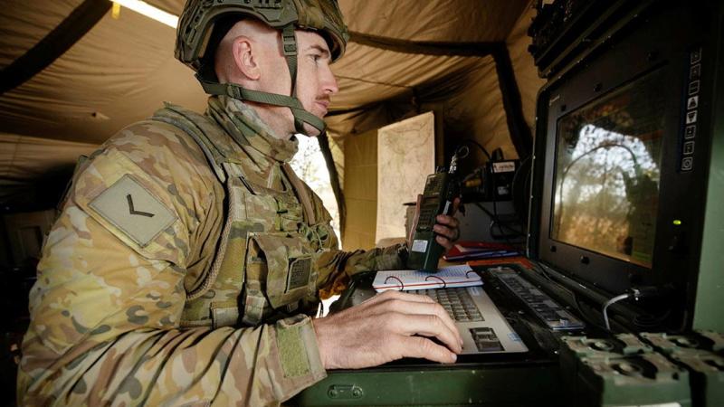 Unmanned aerial vehicle captain Lance Bombardier Lewis Day operates a Shadow 200 from a ground control station during Exercise Dragon Sprint at the Townsville Field Training Area. Photo: Petty Officer Lee-Anne Cooper