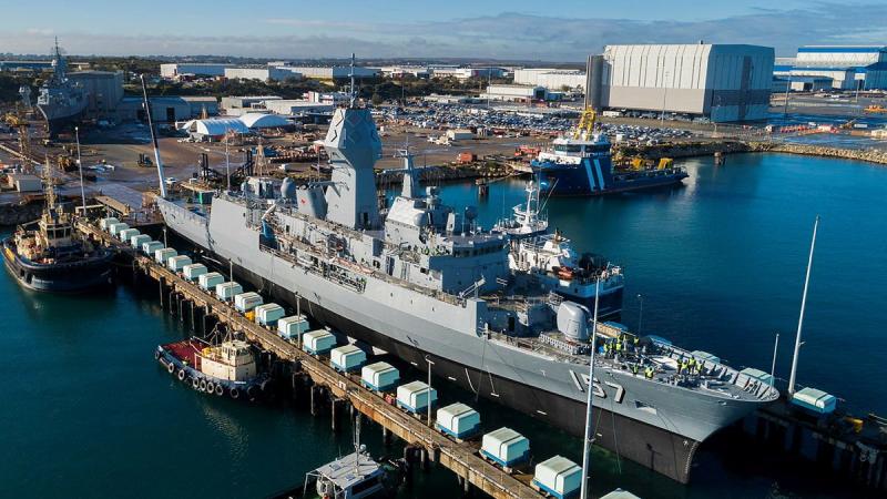 HMAS Perth is lowered out of the dry dock at the Australian Marine Complex at Henderson, WA, after completion of a major part of the Anzac Midlife Capability Assurance Program upgrades.