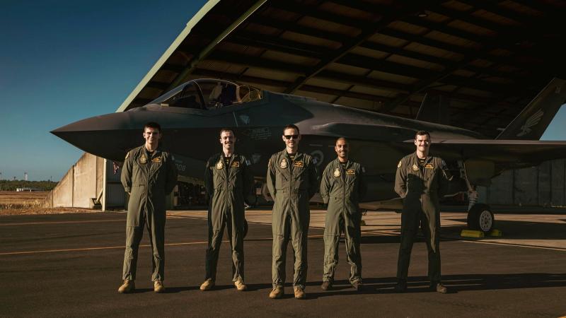 Commanding Officer of No. 2 Operational Conversion Unit Wing Commander Jordon Sander, centre, with the four pilots from the F-35A operational conversion course during Exercise Rogue Ambush 21-1 at RAAF Base Darwin. Photo: Leading Aircraftman Adam Abela