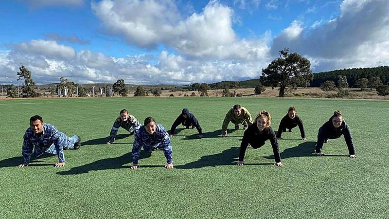 Headquarters Joint Operations Command and Spotless personnel participate in the 2021 Push For Better push-up challenge on the Walter Roy Hyles Field at HQJOC Bungendore, NSW. 