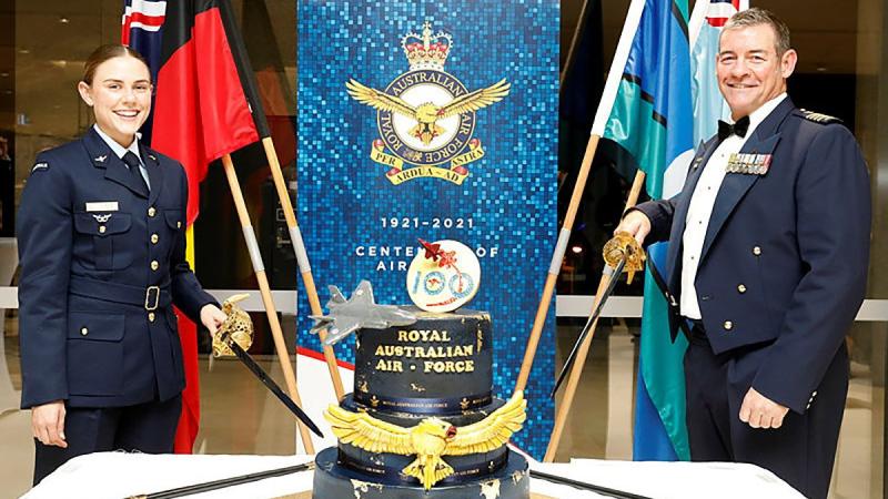 Youngest Aviator Aircraftwoman Jasmine Turner, from RAAF Security and Fire School, and Senior ADF Officer RAAF Base Amberley Group Captain Iain Carty at the reception in Queensland. Photo: Corporal Nicci Freeman