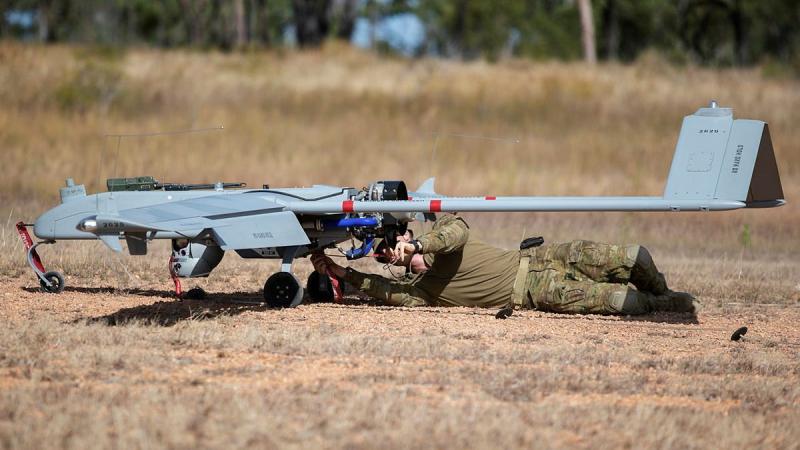 Lieutenant Dallin Stirling attaches post-flight safety tags to a Shadow 200 during Exercise Dragon Sprint at the Townsville Field Training Area. Photo: Petty Office Lee-Anne Cooper