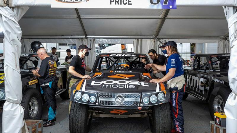 Corporal David Seymour, of the 2nd Cavalry Regiment, speaks with Super Truck driver Toby Price during the NTI Townsville 500 Supercars event. Photo: Corporal Brodie Cross.