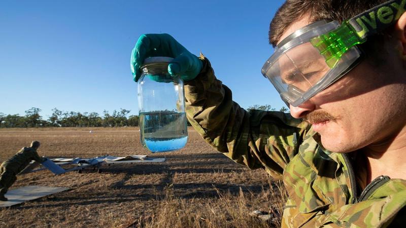 Craftsman Mitchell Toms Camer checks Shadow 200 aviation fuel on the airfield during Exercise Dragon Sprint at the Townsville Field Training Area. Photo: Petty Officer Lee-Anne Cooper